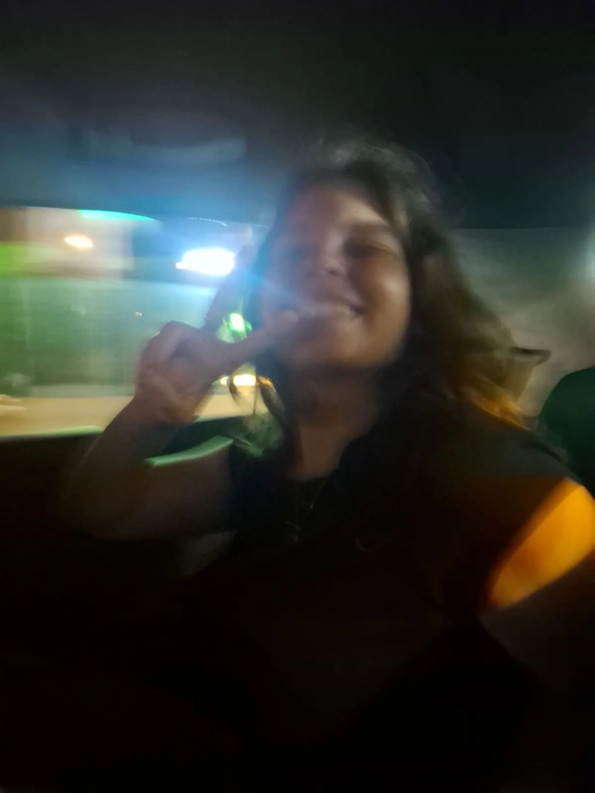 A blurry backseat selfie on the way to the next stop